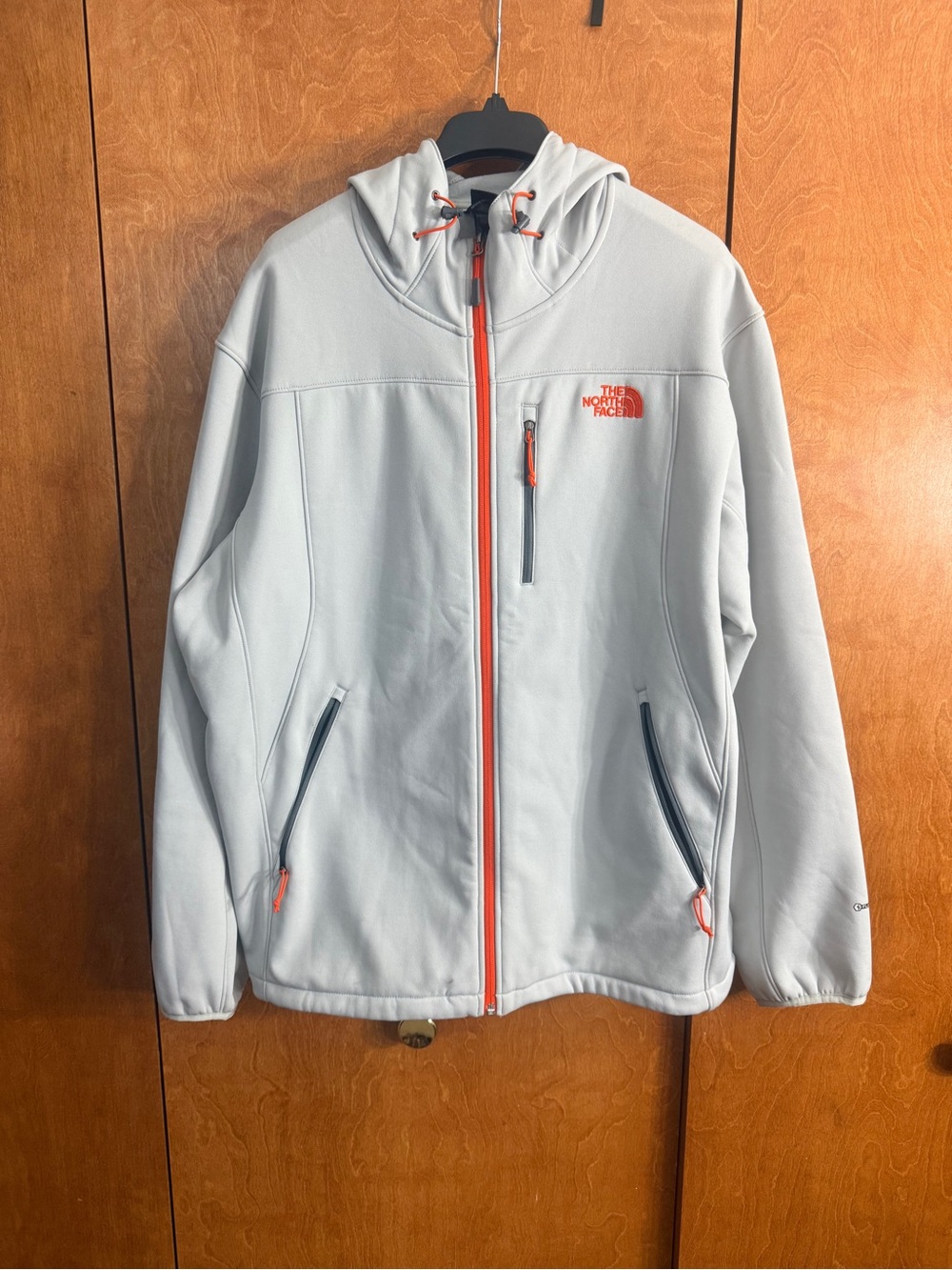 The North Face Light Gray Jacket with Black Logo Tag